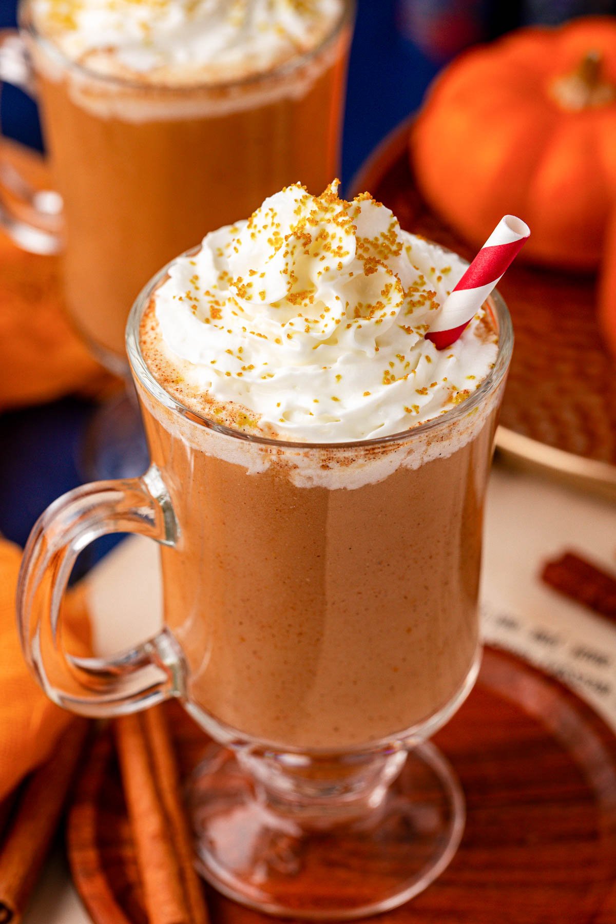 A mug of Harry Potter Pumpkin Juice on a wooden tray.