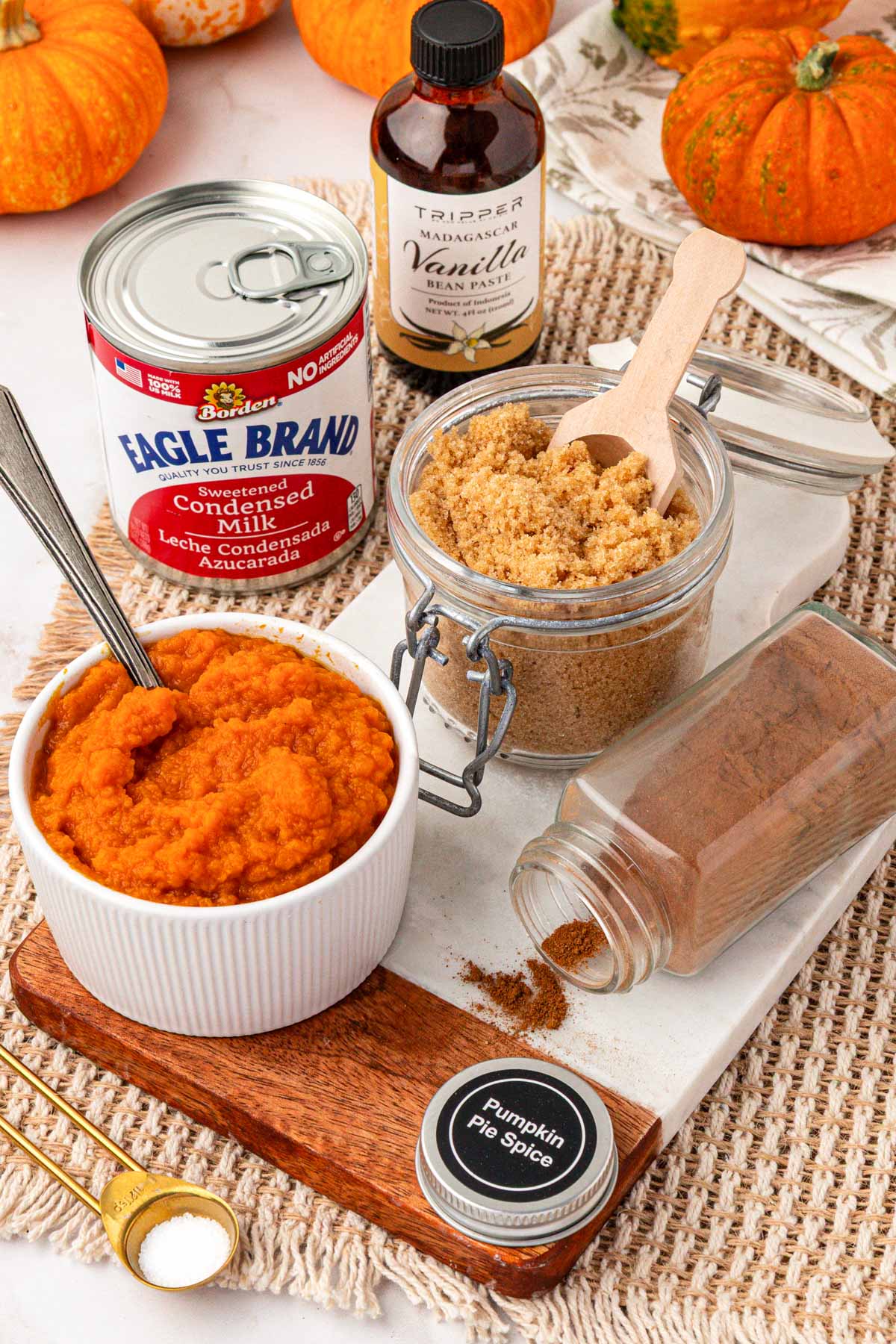 Ingredients to make homemade pumpkin spice syrup on a table.