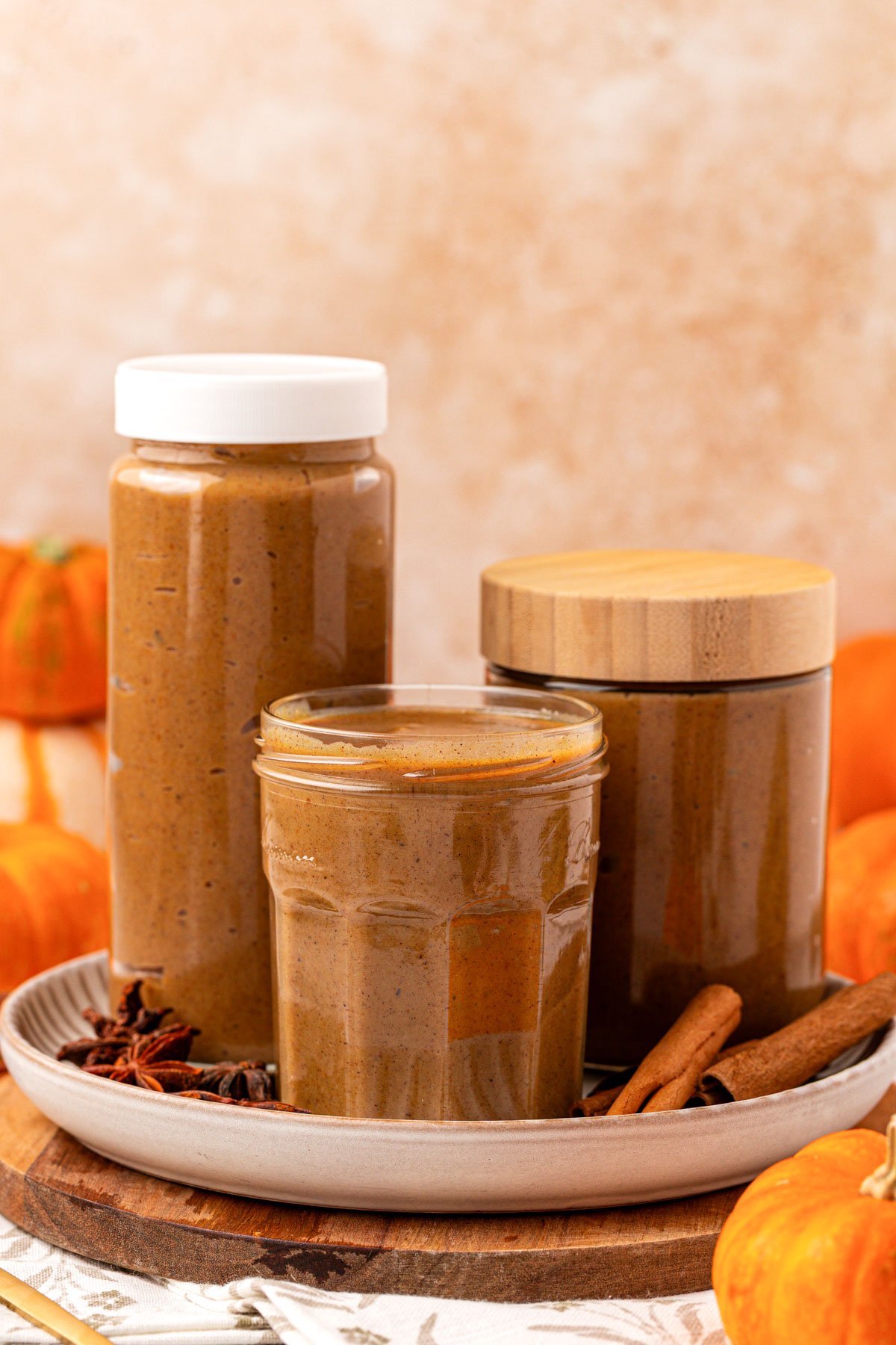 Three Jars of homemade pumpkin spice syrup.