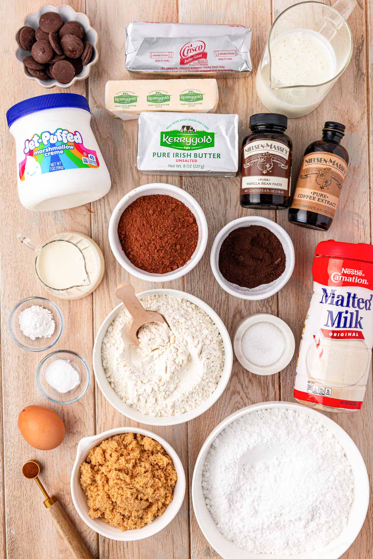 Ingredients to make whoopie pies out on a wooden tables.