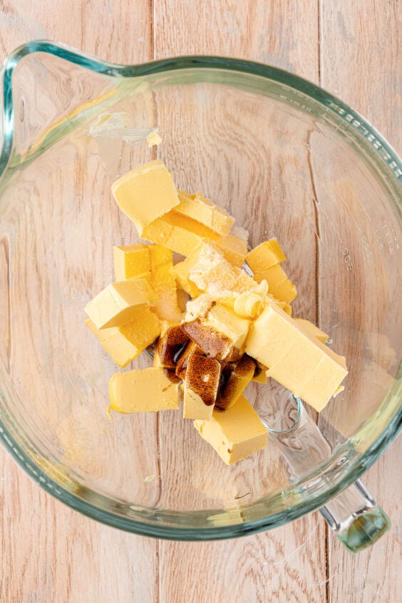 Butter and vanilla in a stand mixer ready to be mixed.