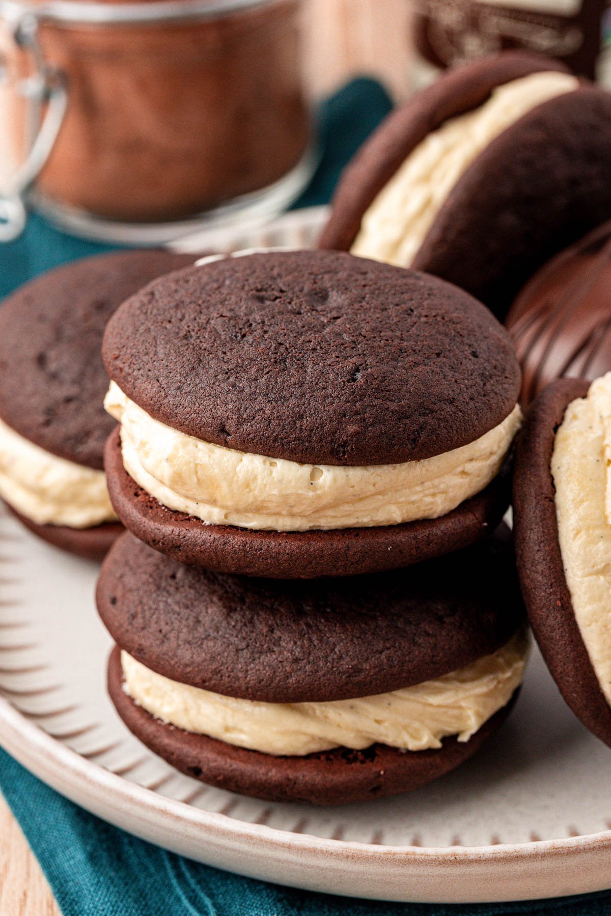 Two whoopie pies stacked on top of each other on a plate.