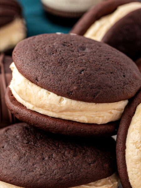 Whoopie pies on a a plate, one is missing a bite.