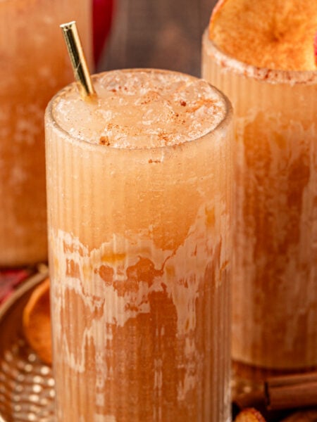 Close up of three glasses filled with apple crisp refreshers.