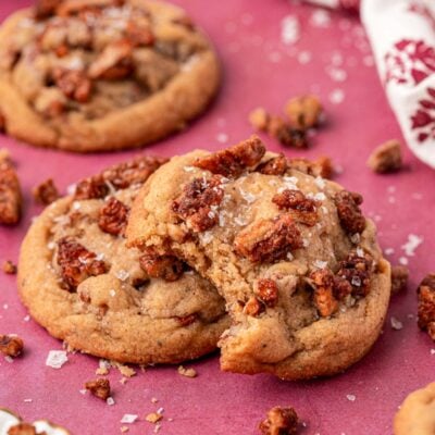 Maple Pecan Cookies on a table, one is missing a bite.