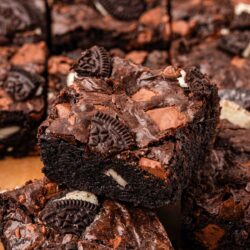 Oreo brownies on a piece of parchment paper.