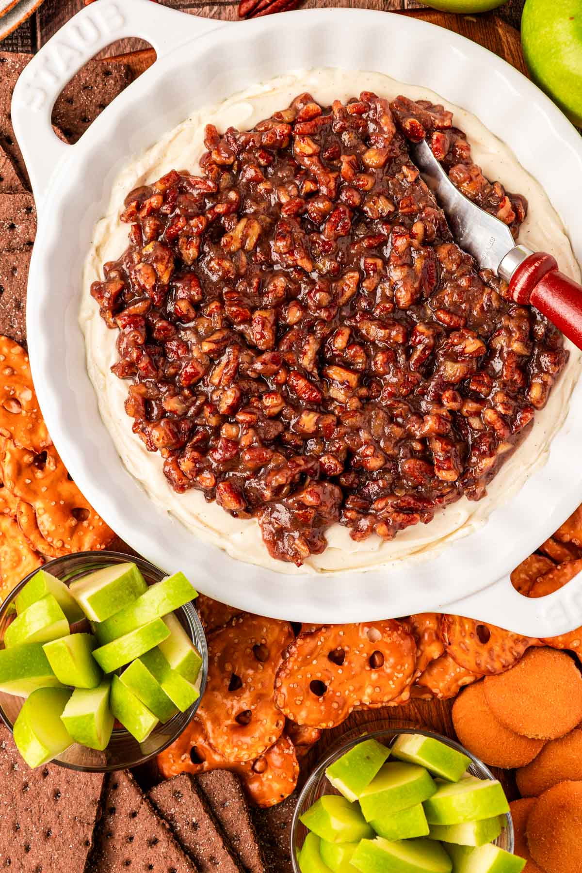 Overhead photo of a white dish filled with pecan pie cheesecake dip.