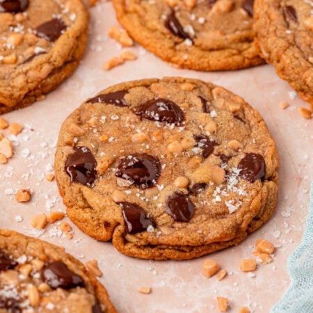 Toffee Brown Butter Chocolate Chip Cookies on a piece of parchment paper.