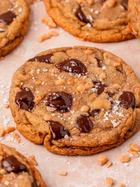 Toffee Brown Butter Chocolate Chip Cookies on a piece of parchment paper.