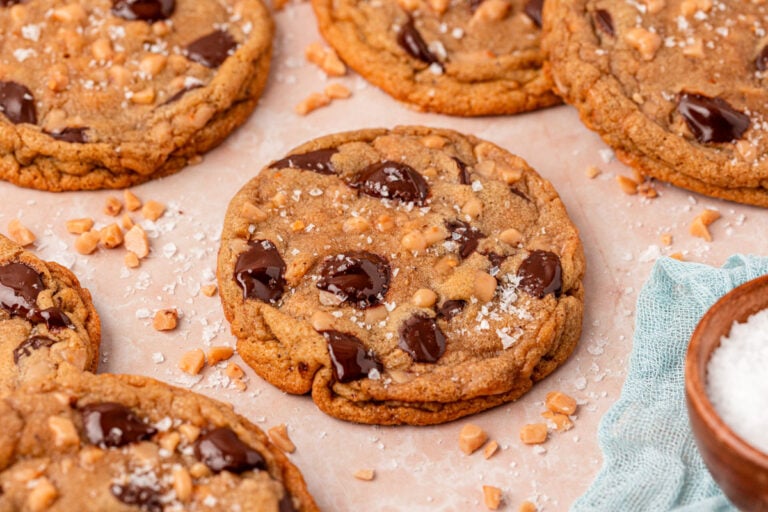 Toffee Brown Butter Chocolate Chip Cookies on a piece of parchment paper.