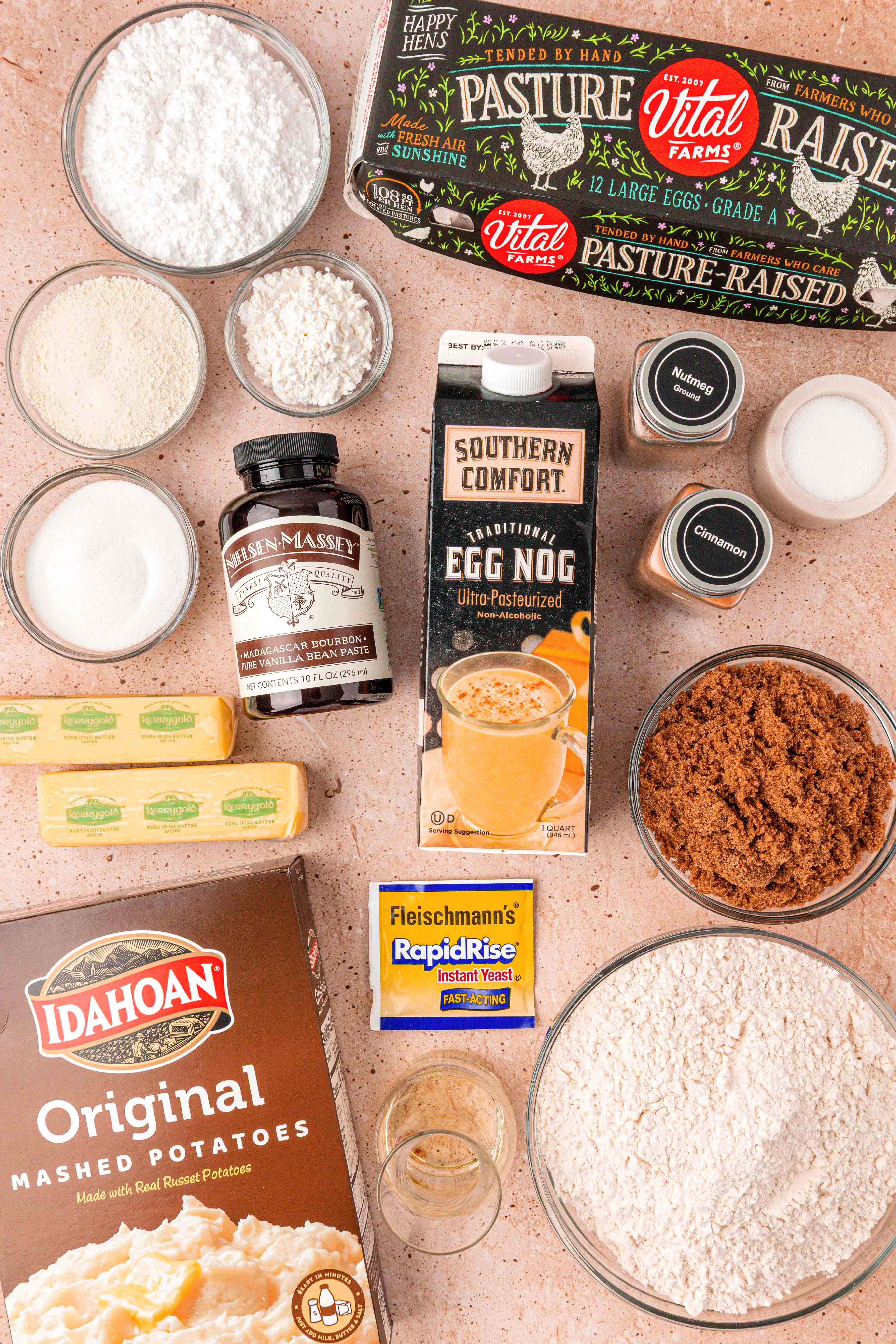 Ingredients to make eggnog cinnamon rolls on a table.