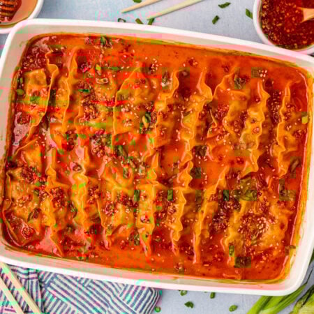 Overhead photo of a white pan filled with viral baked dumplings.