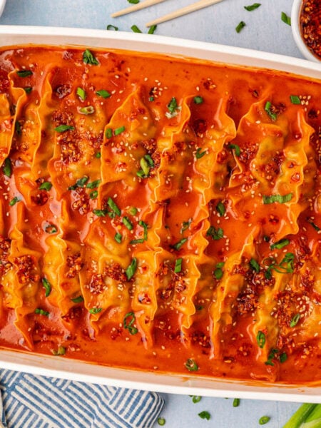 Overhead photo of a white pan filled with viral baked dumplings.