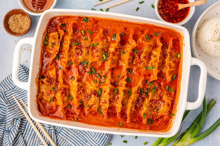Overhead photo of a white pan filled with viral baked dumplings.