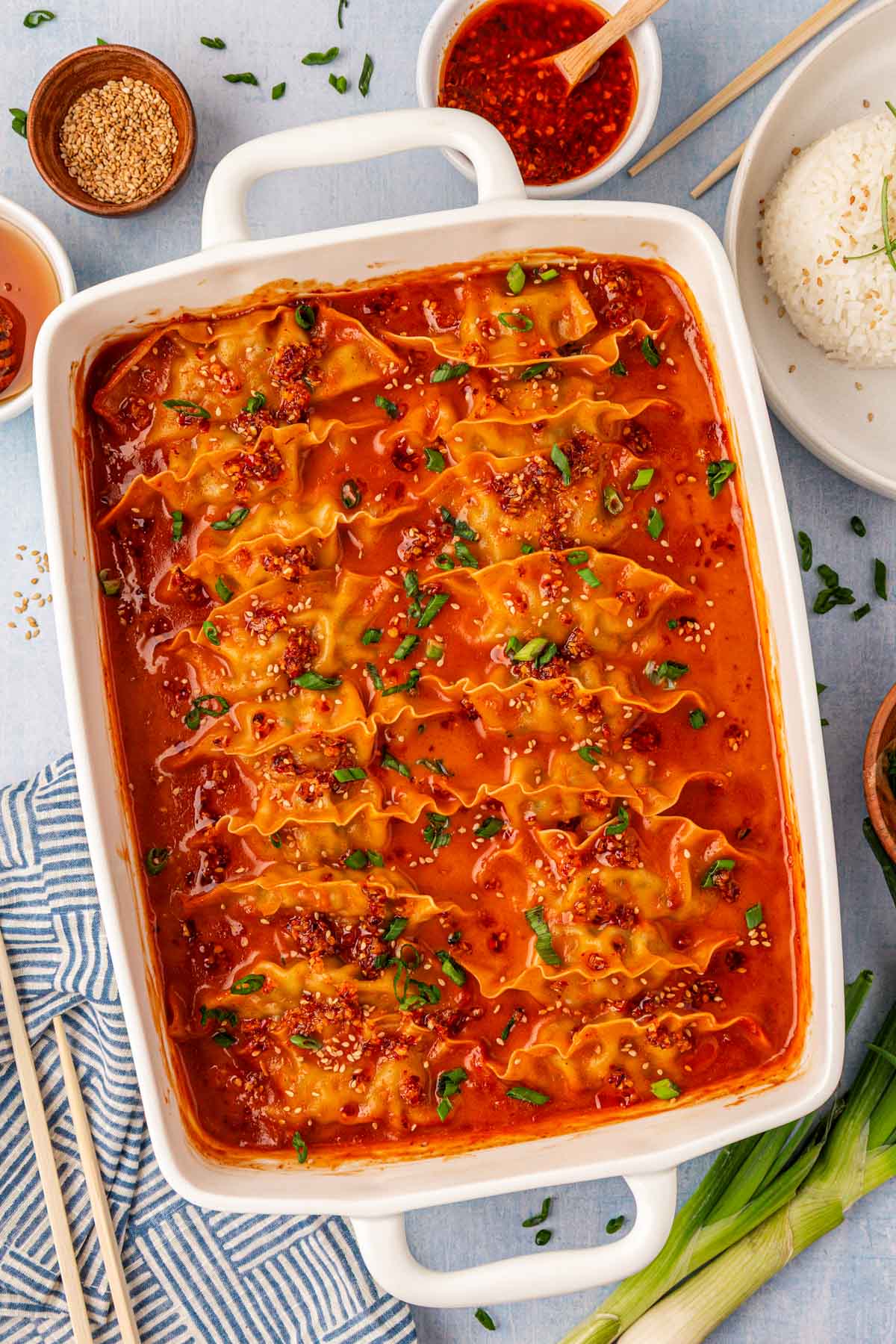 Overhead photo of a white pan filled with one pan viral baked dumplings.