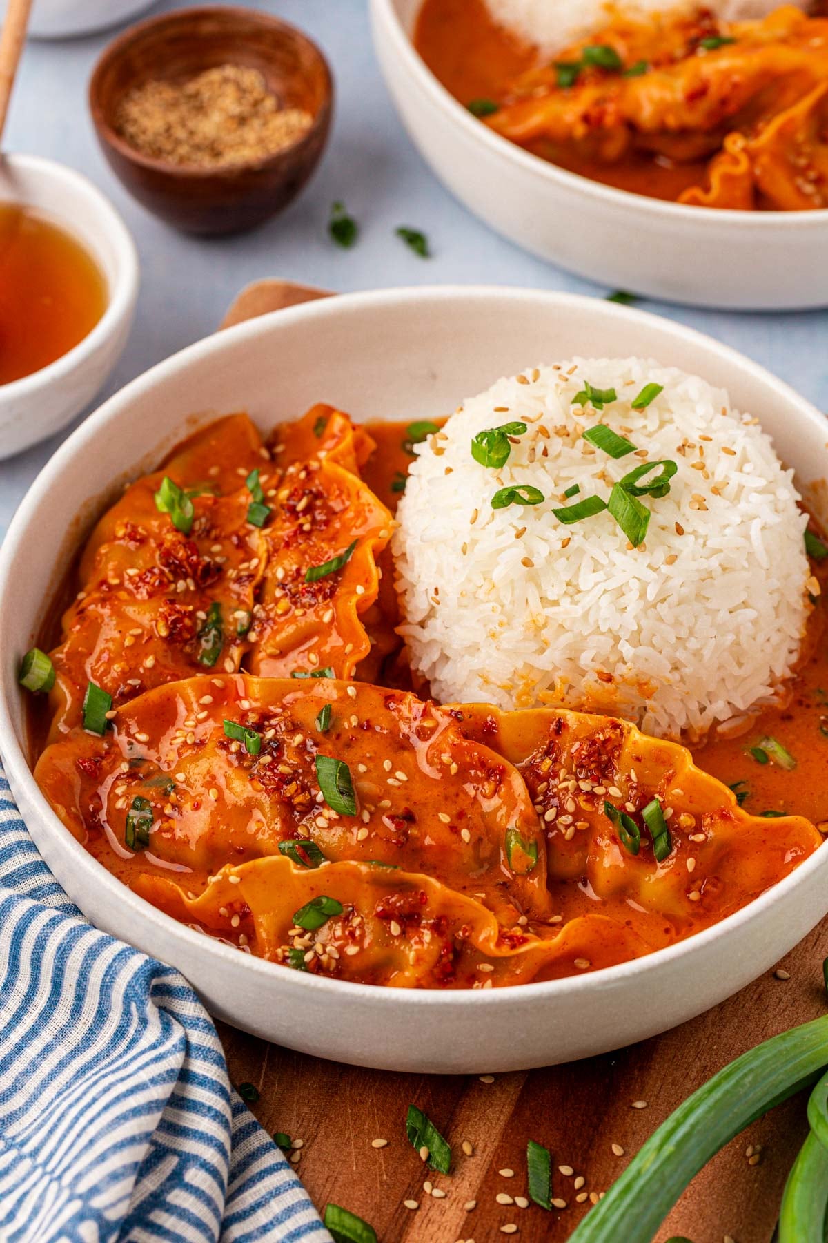 A white bowl with white rice and viral baked dumplings in it.
