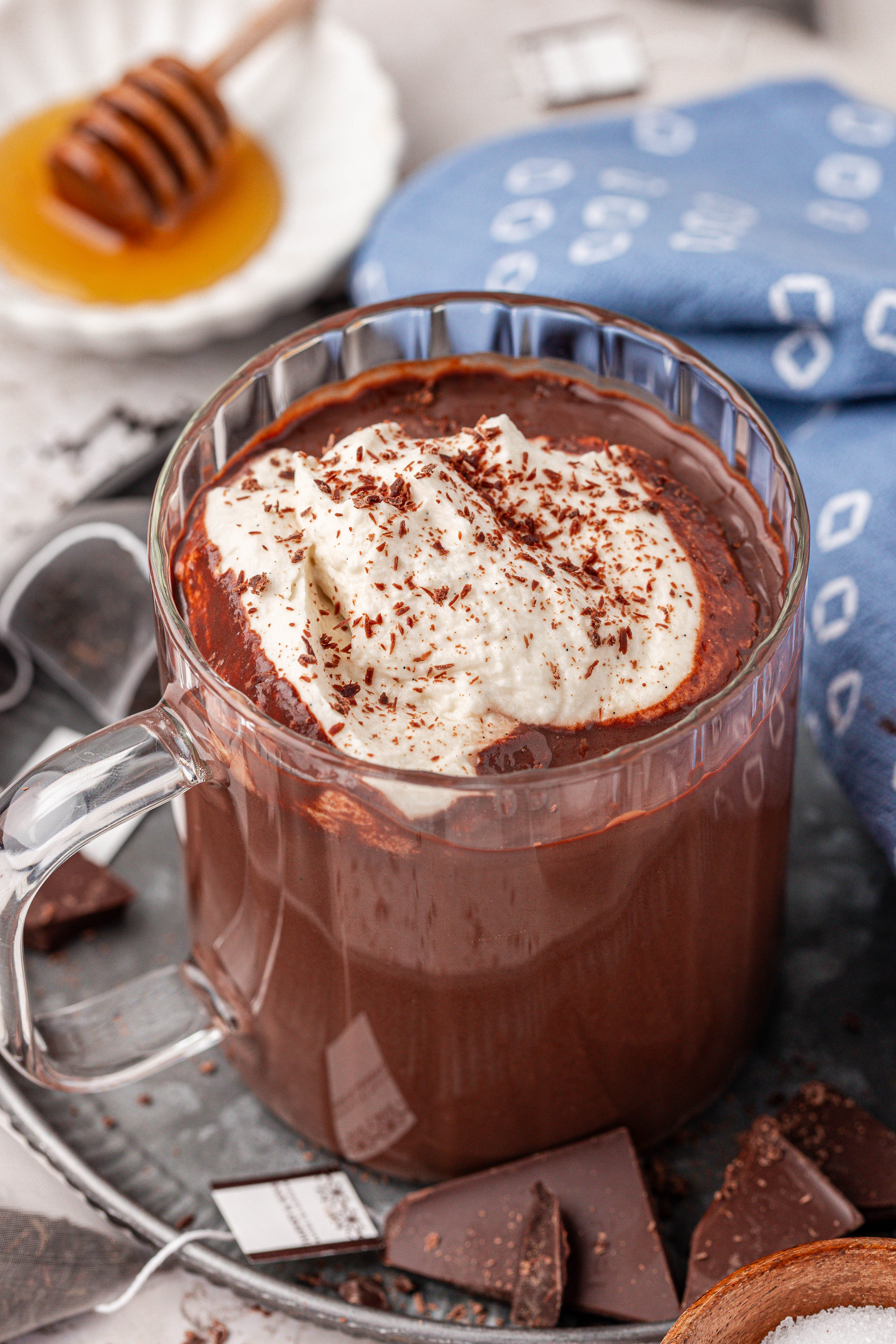 A mug of Earl Grey Hot Chocolate in a clear glass mug. 