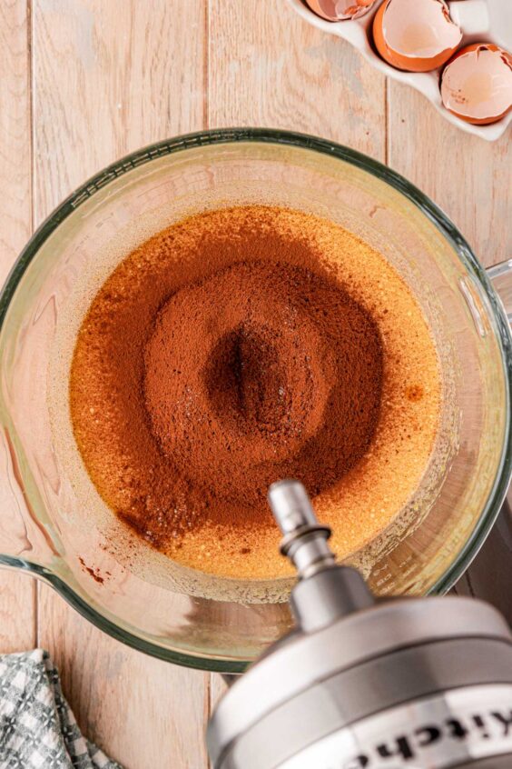 Cocoa and flour sifted into a mixing bowl.