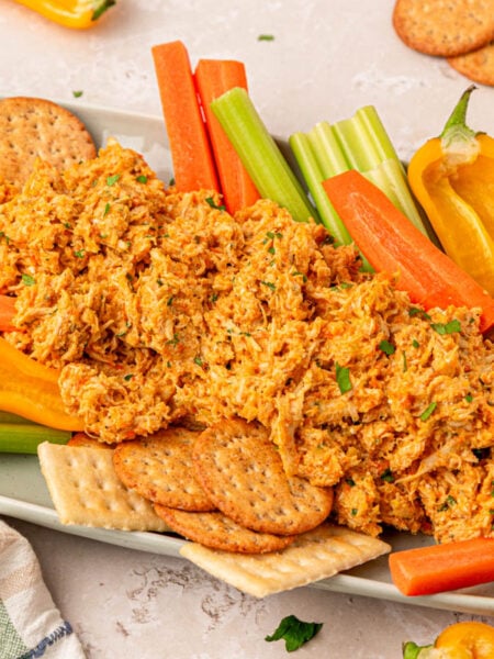 Chicken Soup Chicken Salad on a serving tray with veggies and crackers.