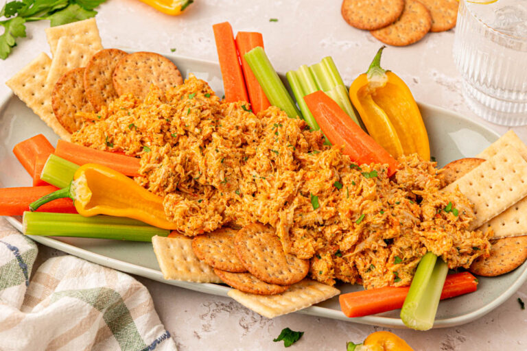 Chicken Soup Chicken Salad on a serving tray with veggies and crackers.
