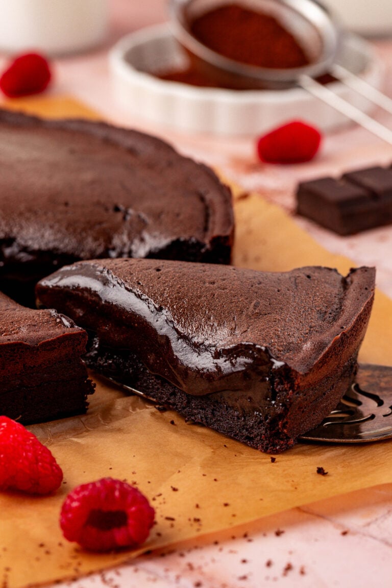 Close up of a slice of Moelleux au chocolat cake on a table.