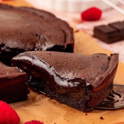 Close up of a slice of Moelleux au chocolat cake on a table.
