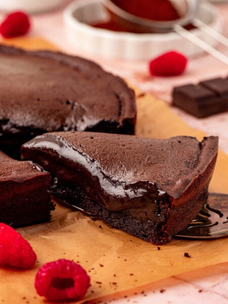 Close up of a slice of Moelleux au chocolat cake on a table.
