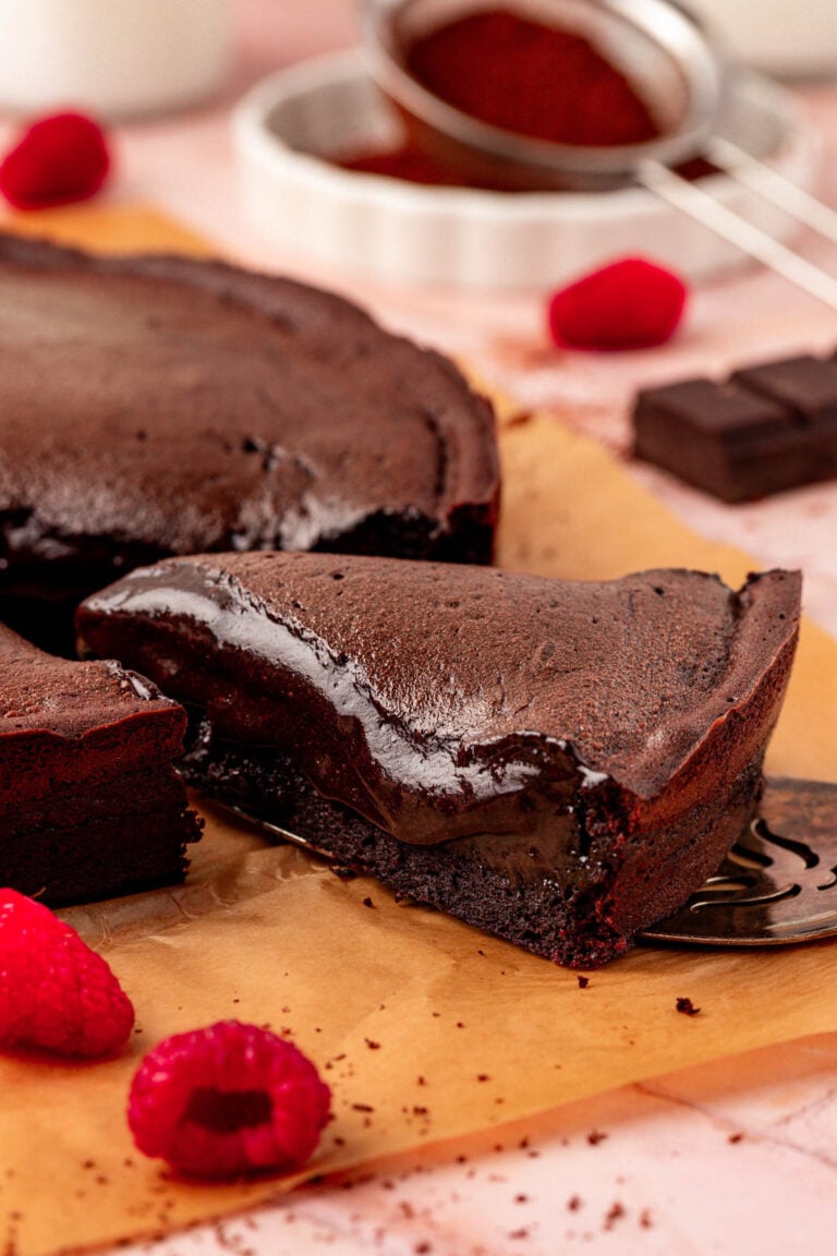 Close up of a slice of Moelleux au chocolat cake on a table.