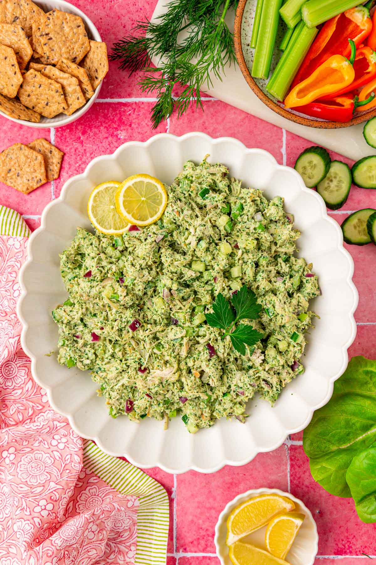 Overhead photo of a white bowl filled with green goddess chicken salad.