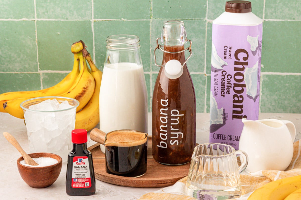 Ingredients to make a Banana Bread Latte on a table.