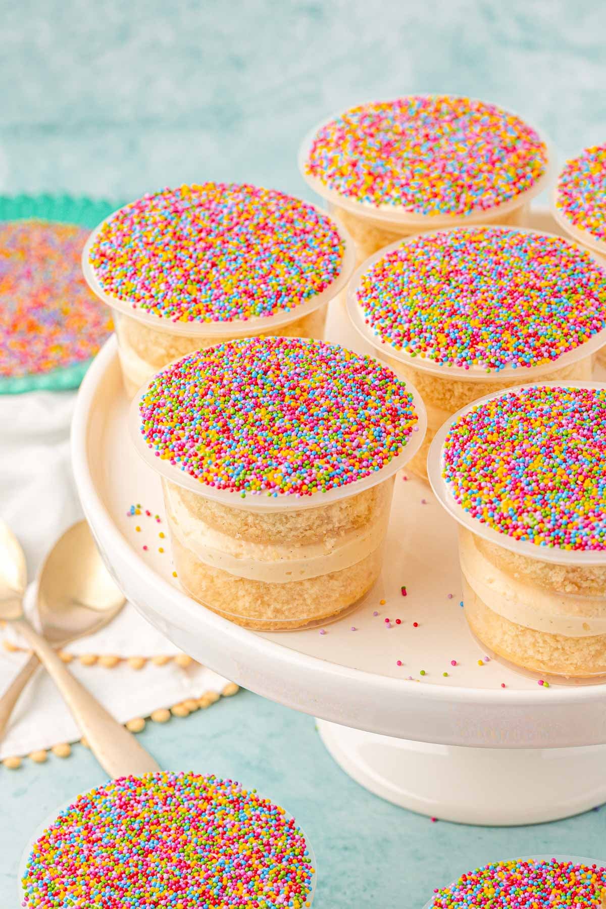 Dot cakes on a white cake stand.