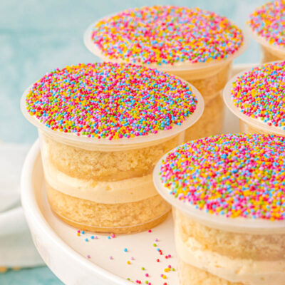 Dot cakes on a white cake stand.