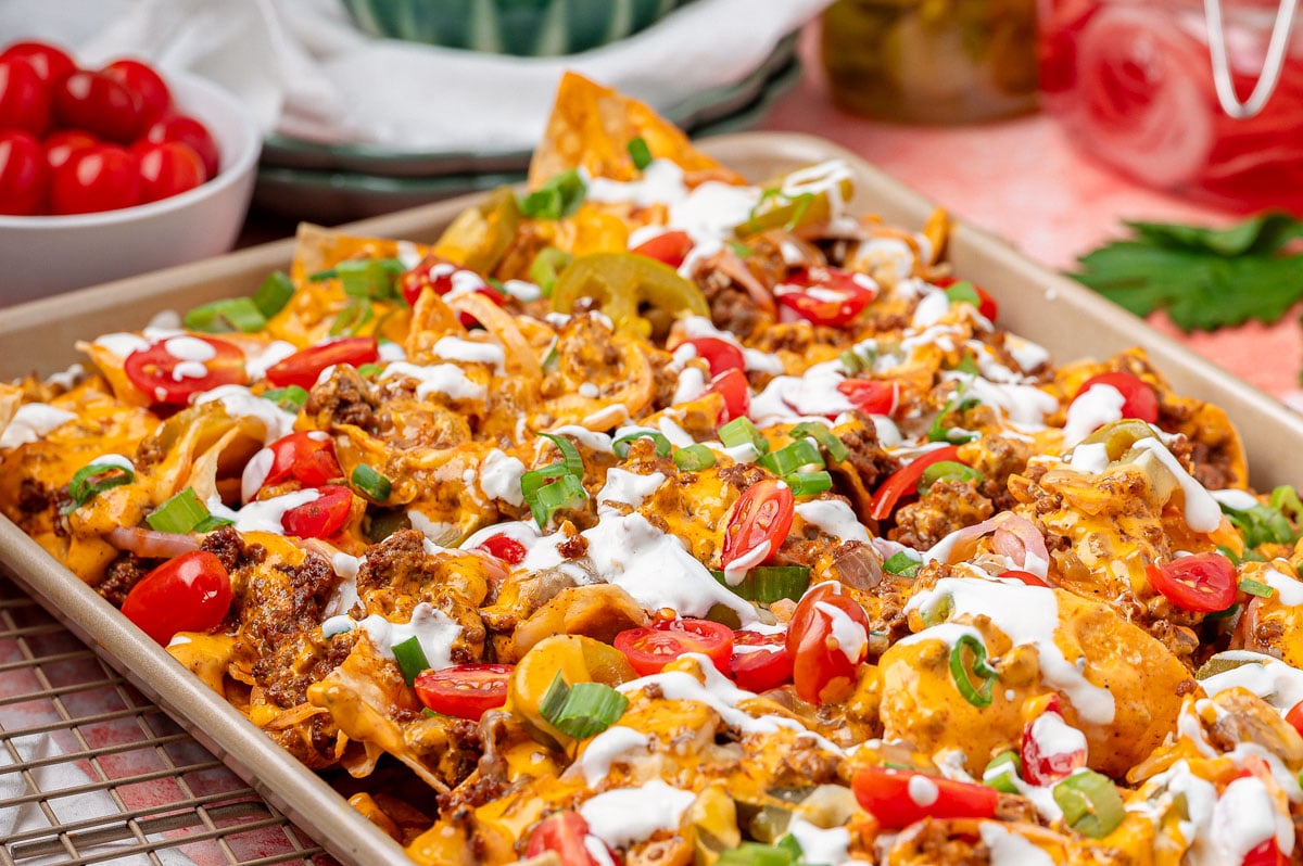 Sheet Pan Sliding Nachos prepared on a pan resting on a cooling rack.