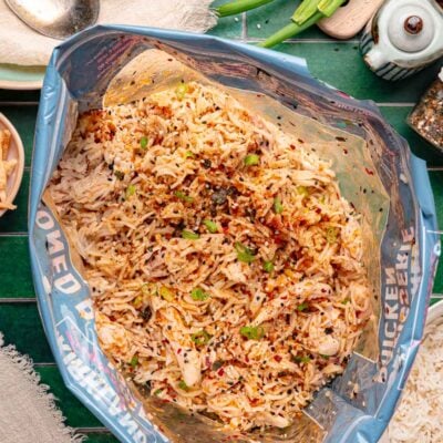 A rotisserie chicken bag filled with rice, shredded chicken, and spices.