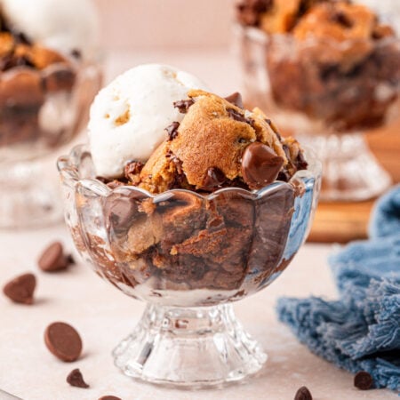 Three ice cream dishes filled with scoopable chocolate chip cookies and vanilla ice cream.