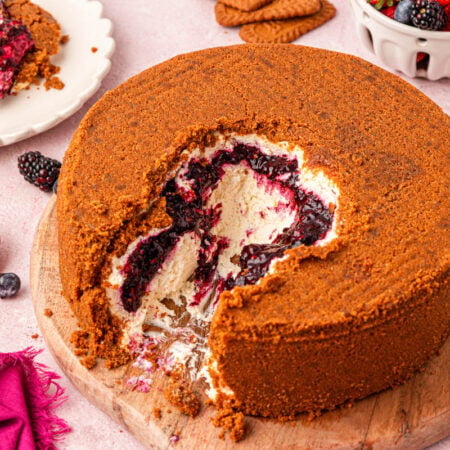 Close up of a viral upside down cheesecake with berry filling and biscoff crust.