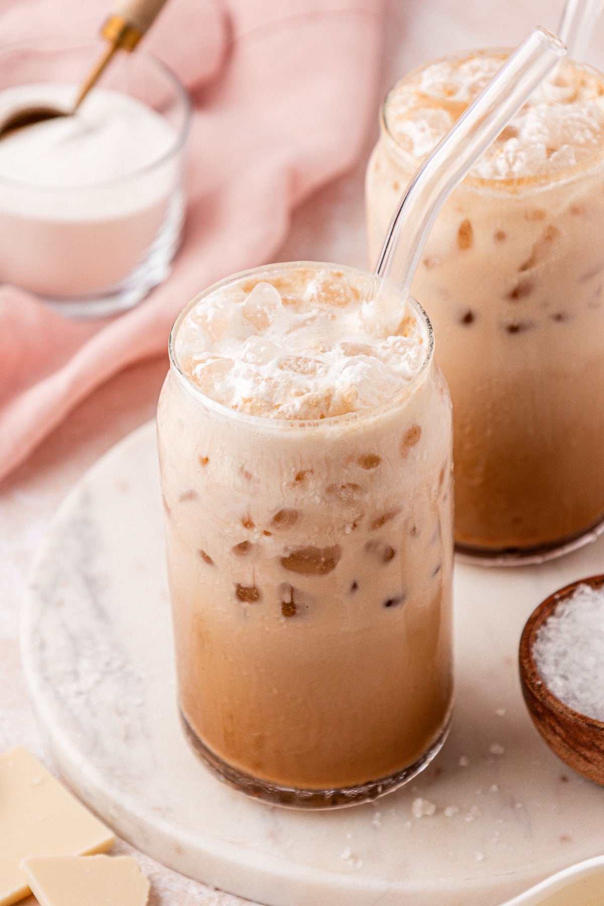 Close up of two glasses with Washington style americano coffees in them.